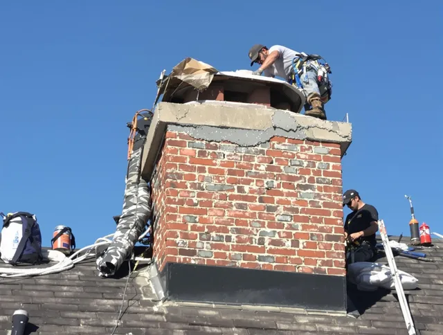 Waterbury Chimney Sweep installing a custom chimney crown in Waterbury, CT