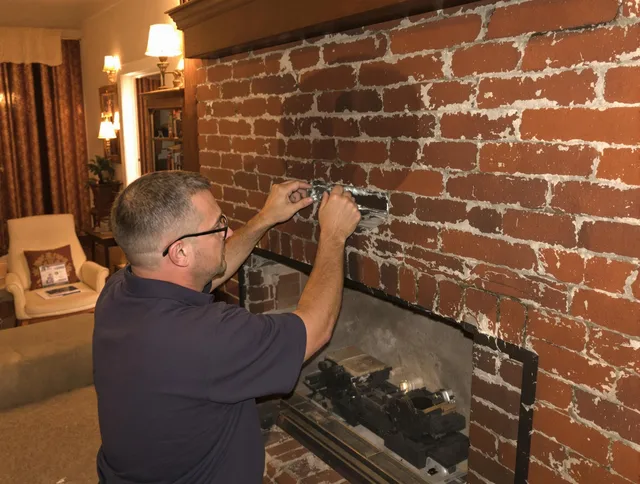 Waterbury Chimney Sweep expert fixing a fireplace in Waterbury, CT
